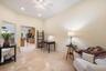 Vaulted ceiling with recessed lighting and a ceiling fan