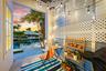Outdoor patio with a white lattice wall, string lighting, and direct canal access