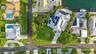 Waterfront property featuring a private boat dock, in-ground swimming pool, and solar panel installation