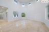 Soaring ceilings with multiple windows