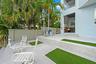Multi-level hardscaping with integrated artificial turf accents