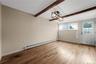 Large Bright Dining Room with Exposed Celilig Beams, Entrance to Backyard