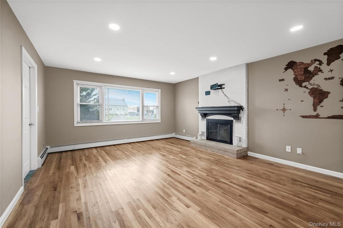Living Room with working Brick Fireplace