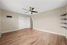 Another view of the Primary bedroom with hardwood flooring