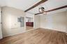 Large Dining Room with entrance to Kitchen Exposed Ceiling Beams