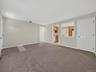 Generous living space flows directly to the summer kitchen, creating a comfortable and highly functional lower level with room to relax, gather and en