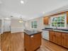 Thoughtfully arranged for everyday living, the kitchen opens naturally to the generous dining area, creating a comfortable space for meals, gatherings