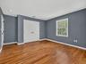 Ample closet provides exceptional storage, adding to the comfort and functionality of this spacious bedroom.