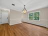Conveniently situated between the attached garage and the rear deck, the dining area provides seamless access for daily living and effortless indoor-o