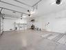 Immaculate garage with epoxy flooring, topped by a spacious, nearly 800-square-foot interior in-law suite complete with a full bathroom