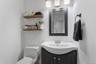 Full hall bathroom with glass enclosed shower