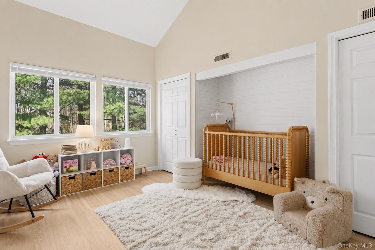 Secondary bedroom with cathedral ceilings.