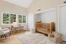 Secondary bedroom with cathedral ceilings.