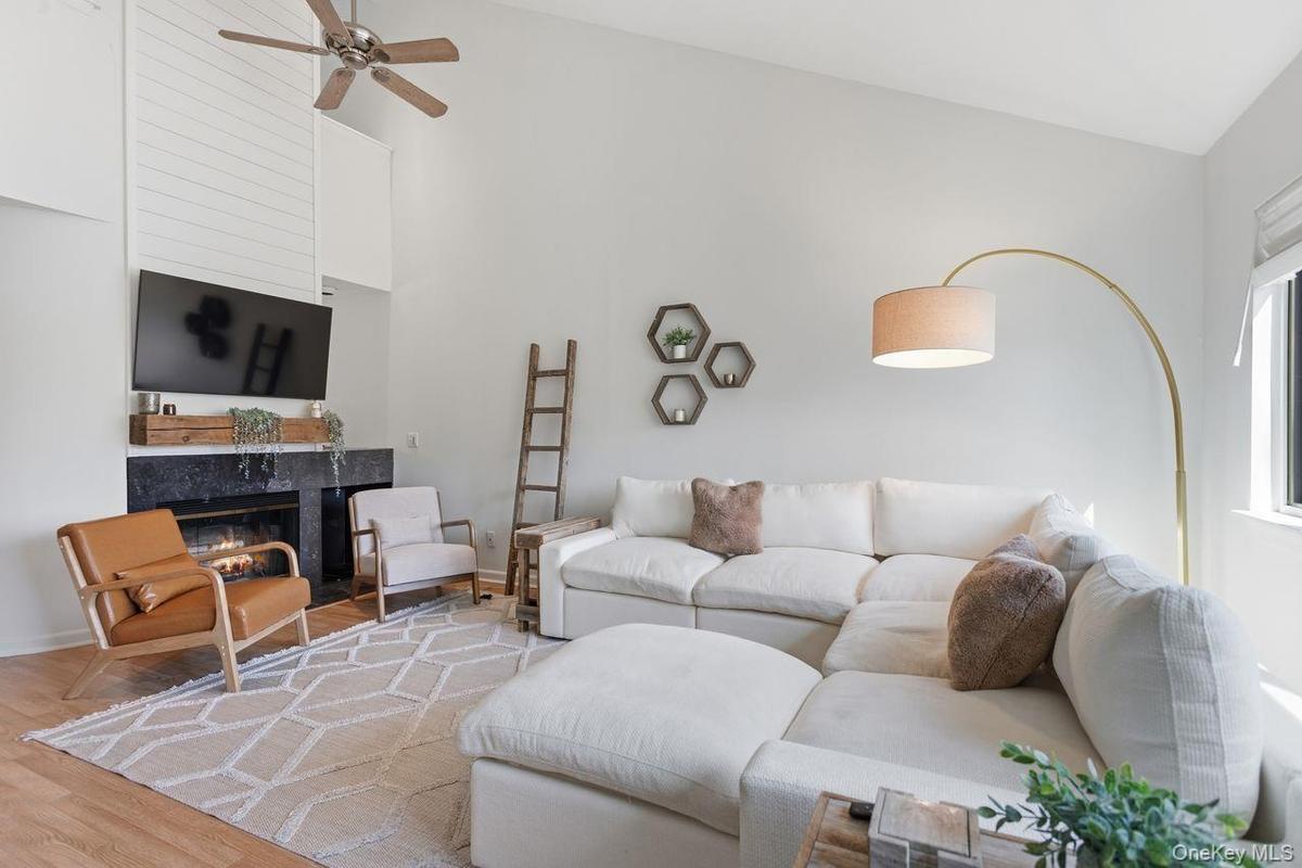 Living room with wood burning fireplace