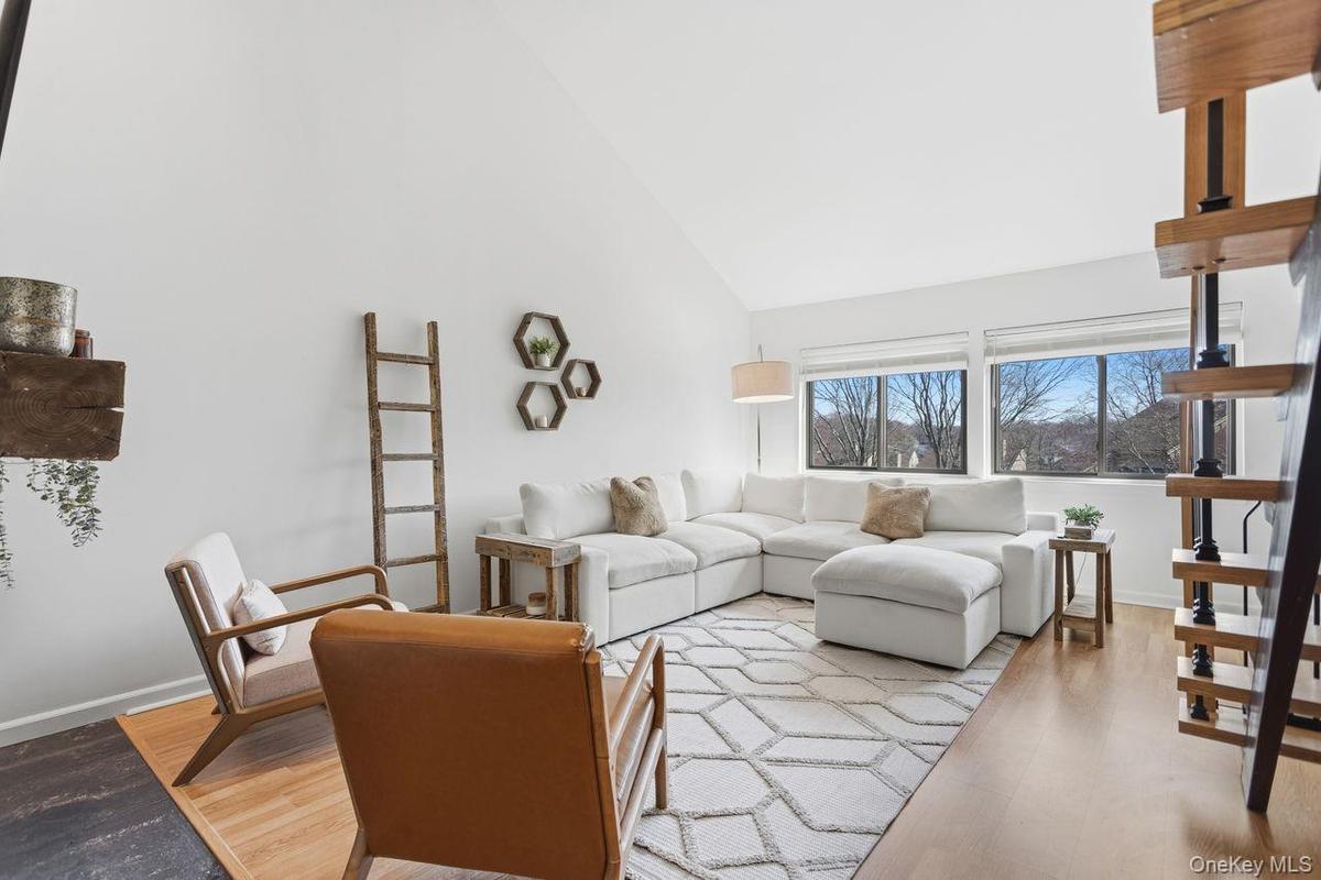 Living room with cathedral ceilings.