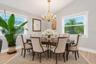 Virtually staged to illustrate how this spacious, versatile area can easily accommodate a beautiful formal dining setting.