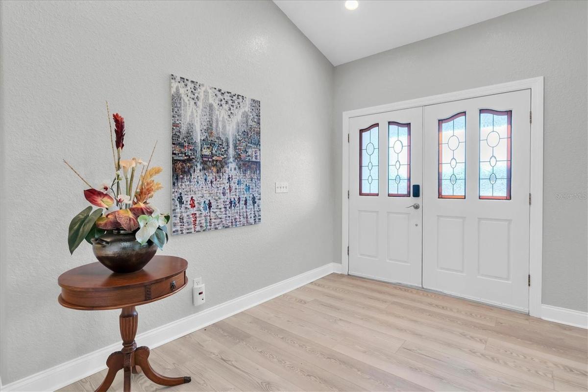 A welcoming foyer introduces the home’s light, bright and spacious interior.