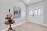A welcoming foyer introduces the home’s light, bright and spacious interior.