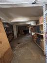 Additional storage area has access to the rear parking and also access to the lobby staircase.