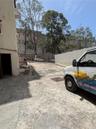 The rear parking/loading area has secure gated access from Calle Cerra. The puerto Rico Conservatory of Music is in the background.  The door at the l