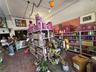 Retail space has high ceilings and goes the complete length of the building (front to back).