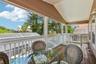 Second floor screened patio and stairs to the pool area