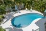 The inviting pool area features a spacious cool deck with plenty of room for lounge chairs, creating the perfect setting for relaxing & enjoying the F