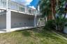 Beyond the pool, additional backyard space provides even more room for outdoor entertaining, recreation, gardening or simply enjoying the tropical sur