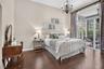 Master bedroom overlooking the pool and lake.