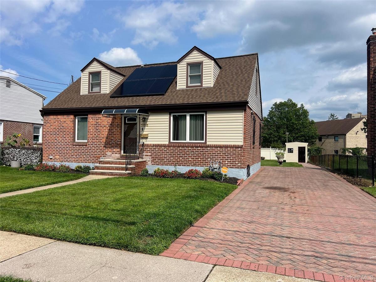 Brick and siding exterior with solar panels
