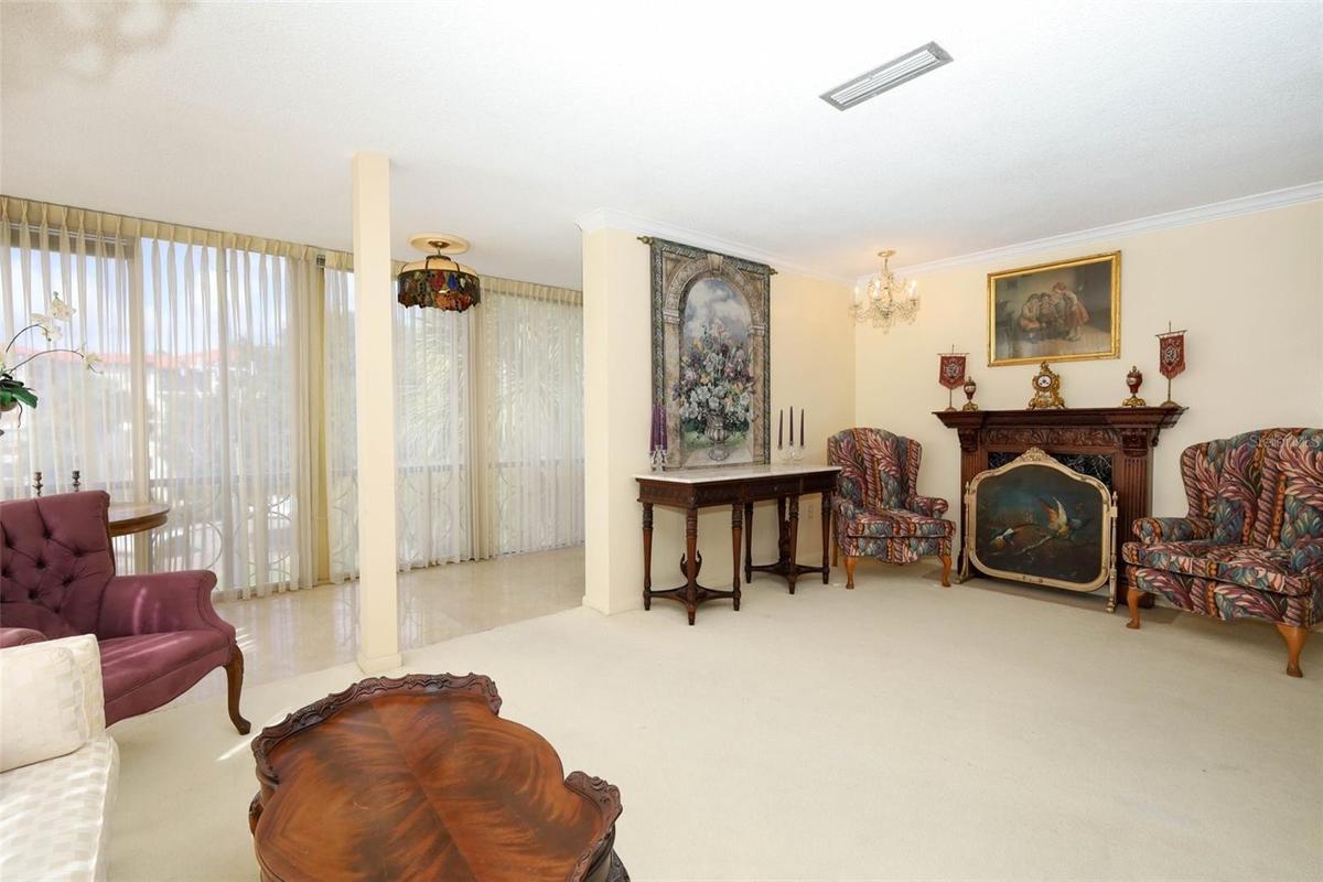 Living room & flex space with tiled floors.