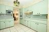 Kitchen with cooktop with separate oven