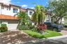 This lovely townhome features an oversized 1-car garage and lush, mature landscaping.