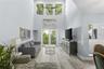 Soaring ceilings set the tone for this bright, open living area.