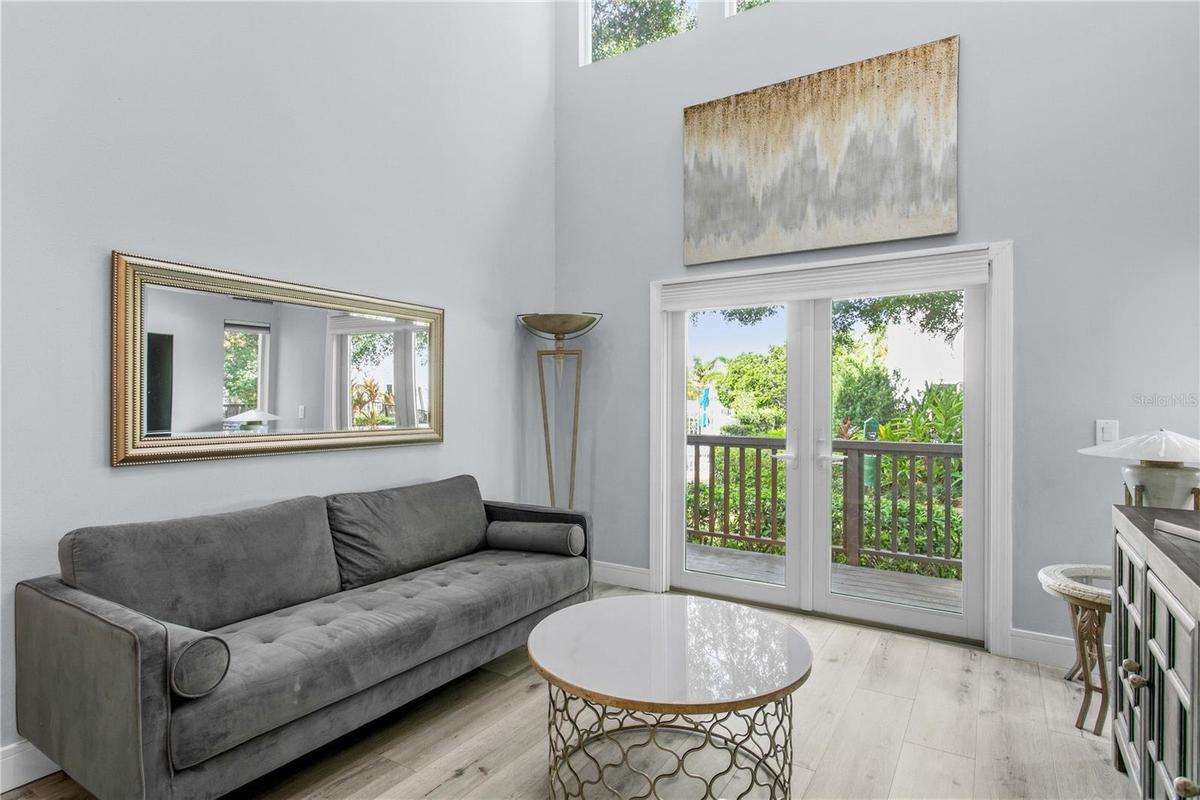 The living room is complete with new French doors that lead to your private deck.