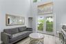 The living room is complete with new French doors that lead to your private deck.