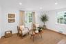 Recessed lighting, light wood-finish flooring, white walls, and multiple windows with white trim