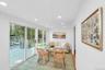 Sun room off kitchen, living room area, sliding doors to deck