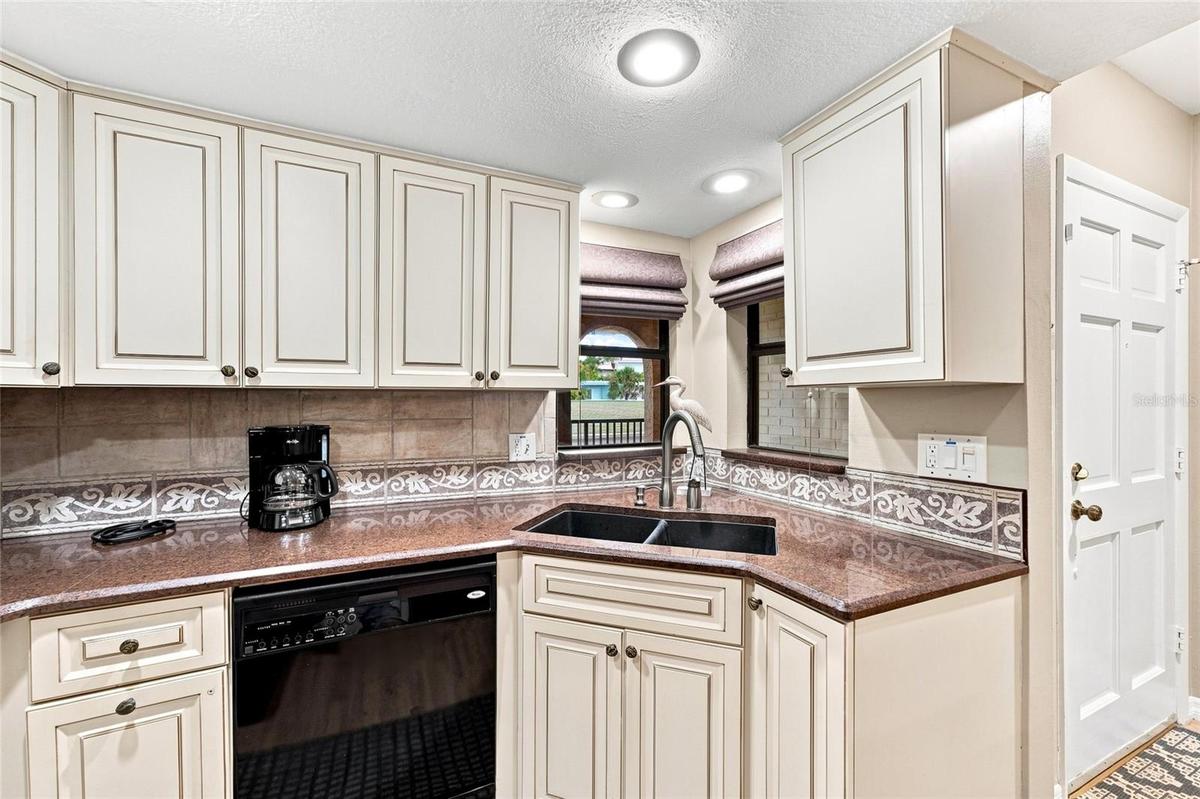 Kitchen with white cabinetry
