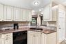 Kitchen with white cabinetry