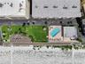 Aerial top-down view of complex with pool