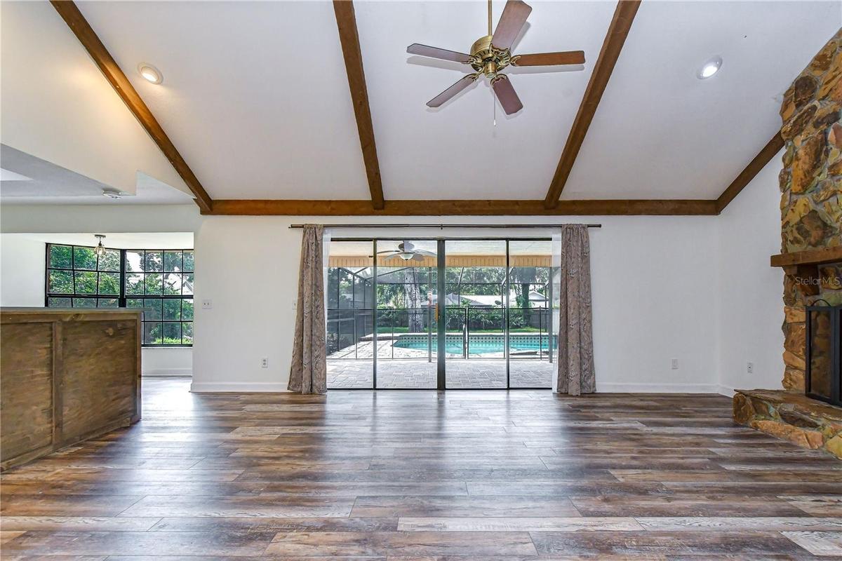 Grand sliders create a seamless connection between the family room and screened lanai