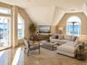 Virtually staged living-furniture and decor have been digitally added
