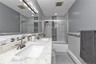 Full hallway bath with dual vanity