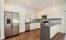 Kitchen with stainless steel appliances, open shelves, white cabinetry, recessed lighting, and dark wood-type flooring