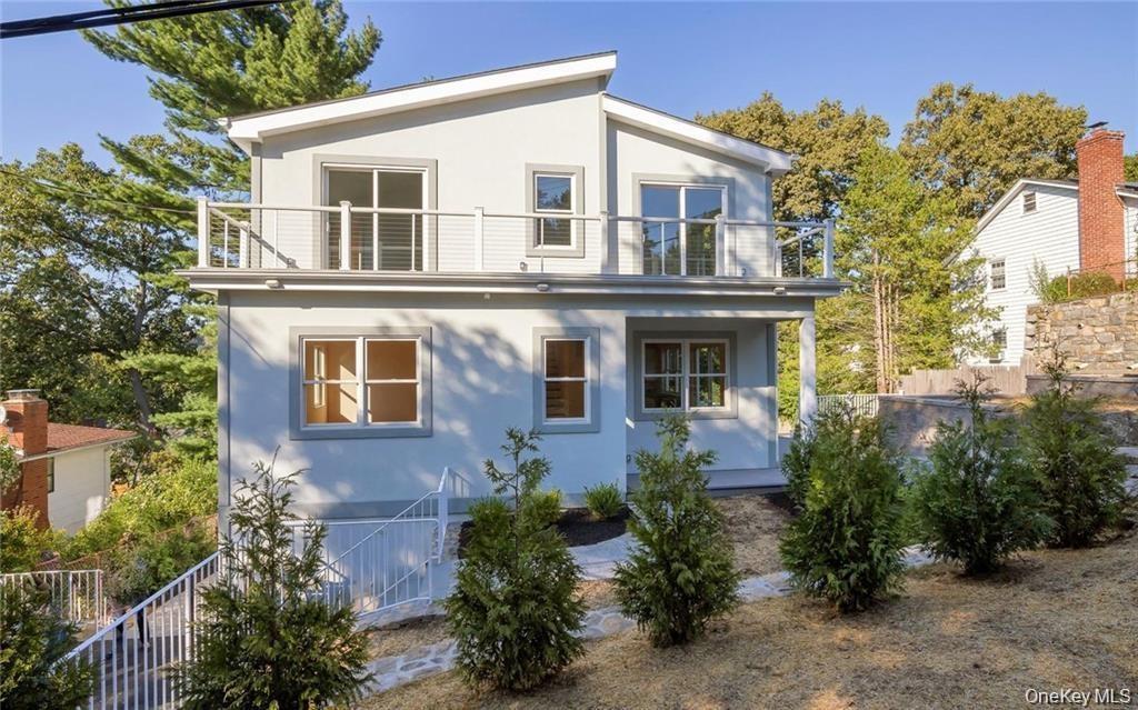 Rear view of house featuring stucco siding