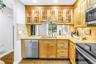Great Kitchen workspace with glass cabinets for Natural light.  Granite Counters and stainless appliances