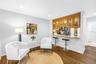 Sophisticated Kitchen and Lounge area opens to screened porch and expansive grassy fenced yard