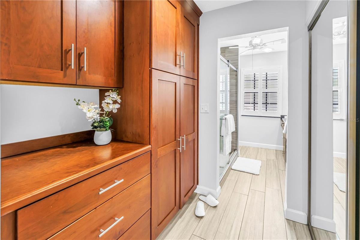 Primary en Suite Bath with Coffee Service area and beautiful Custom Cabinetry.  Great Storage!