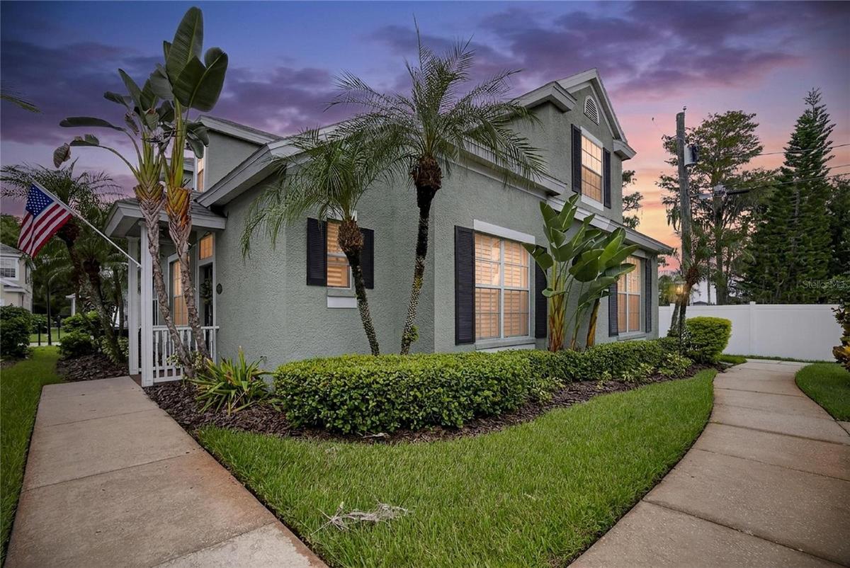Neo-traditional architecture with classic charm and tropical Florida landscaping